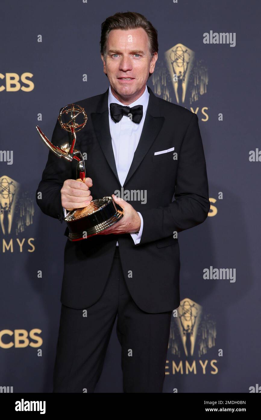 Ewan McGregor poses for a photo with the award for outstanding lead