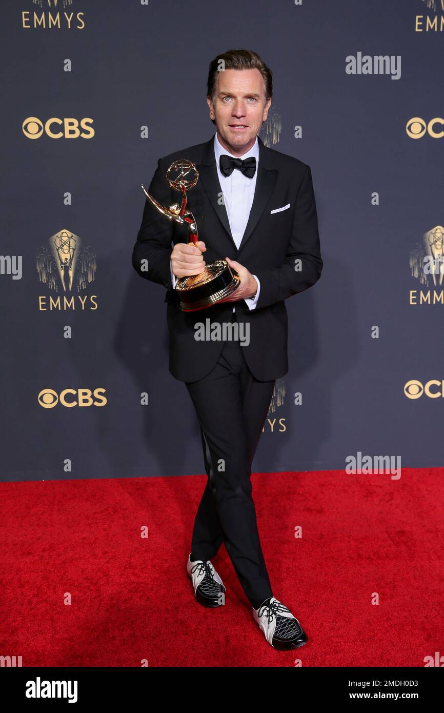 Ewan McGregor poses for a photo with the award for outstanding lead
