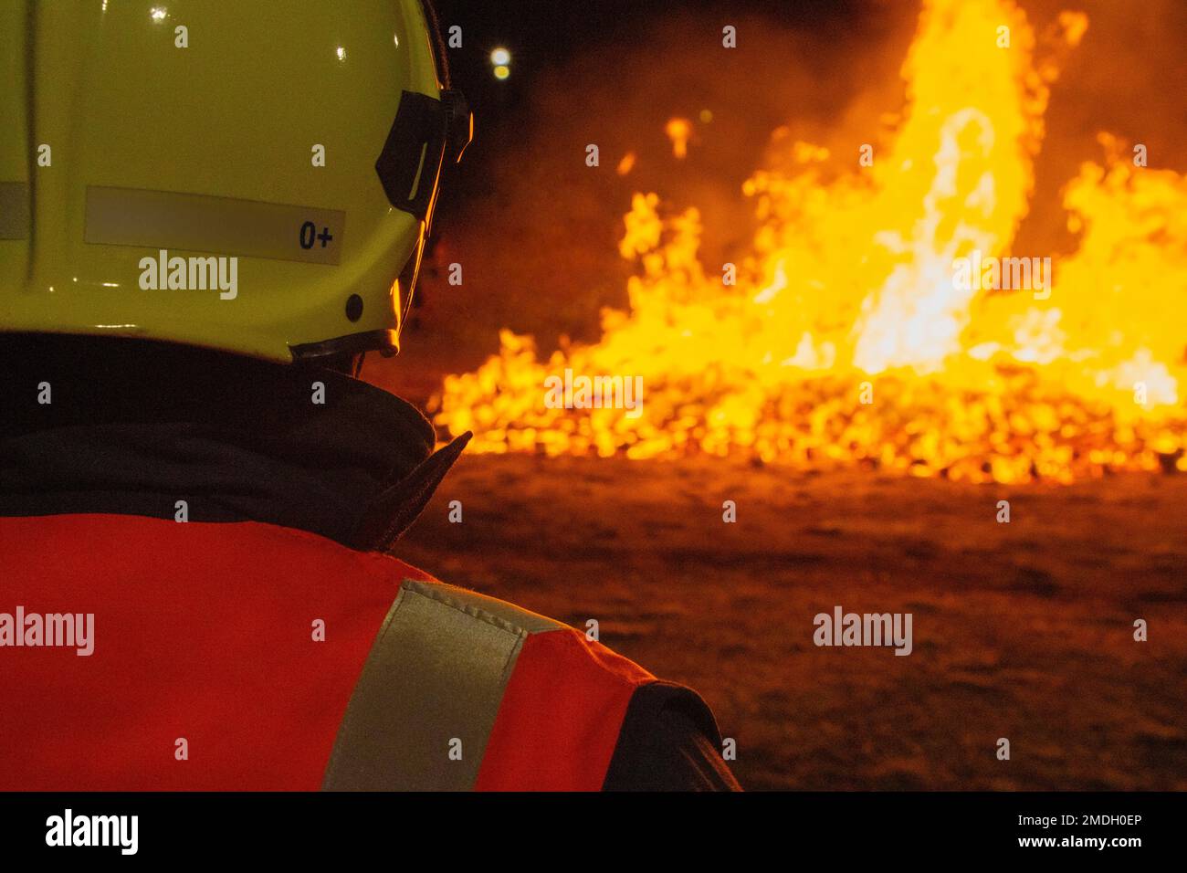 Firefighter putting out a fire. Accident and disaster. Protection Stock