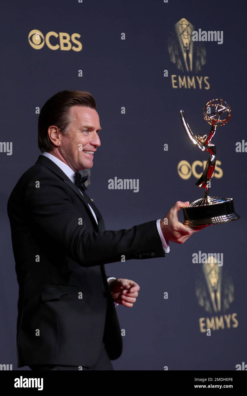 Ewan McGregor poses for a photo with the award for outstanding lead