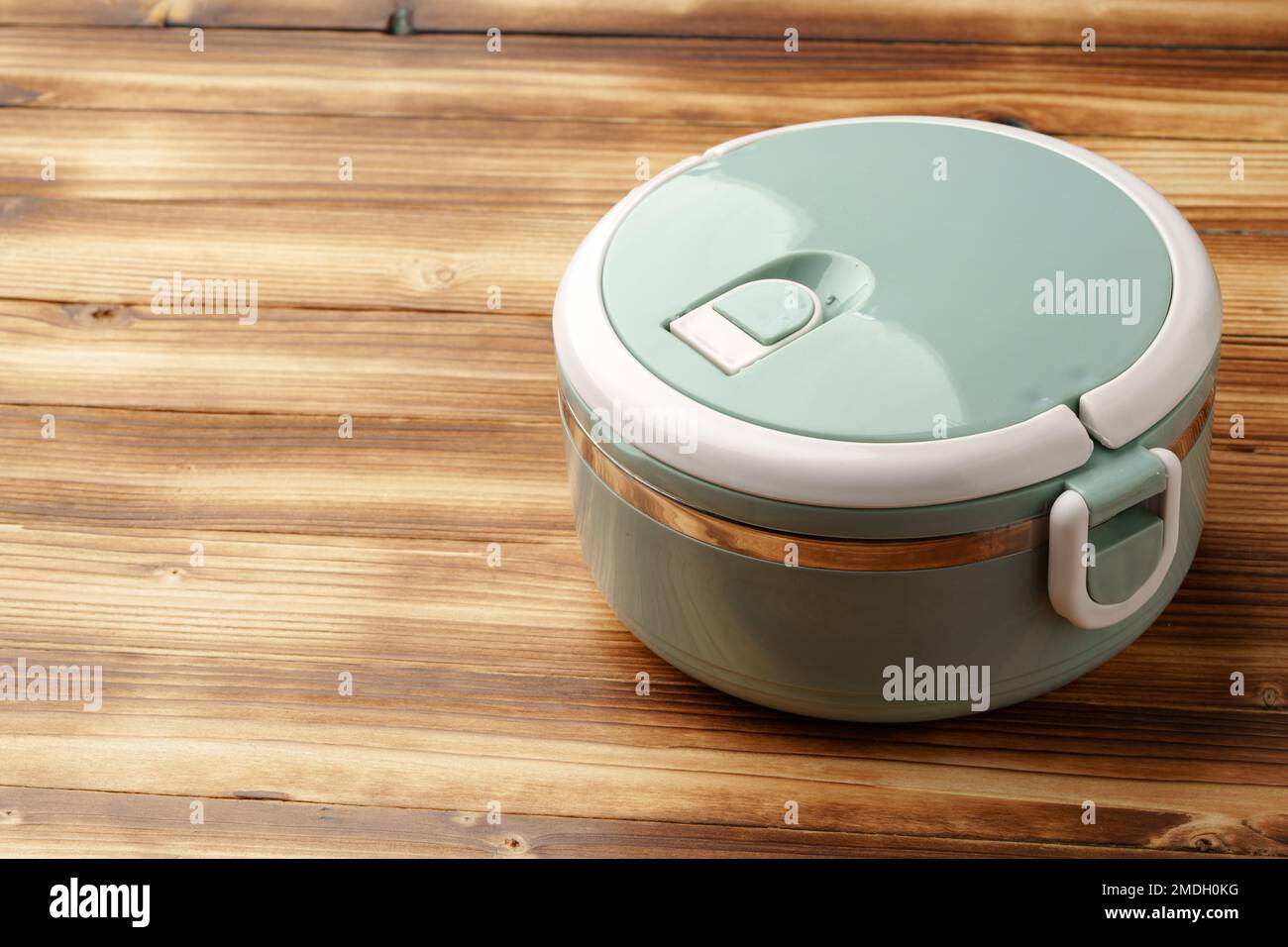 New empty plastic lunch box on a wooden background Stock Photo