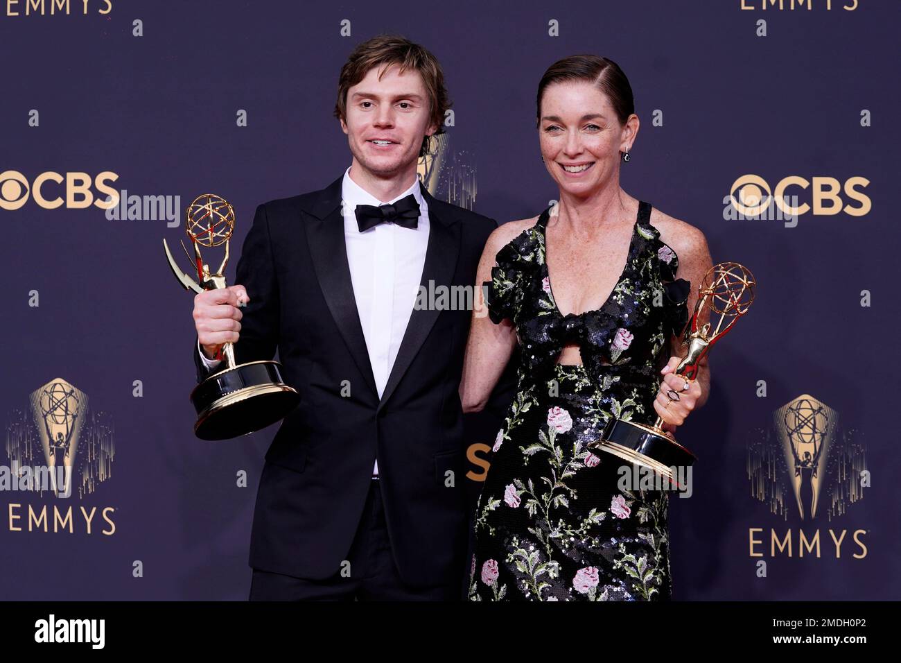 Evan Peters, left, and Julianne Nicholson pose for a photo with the