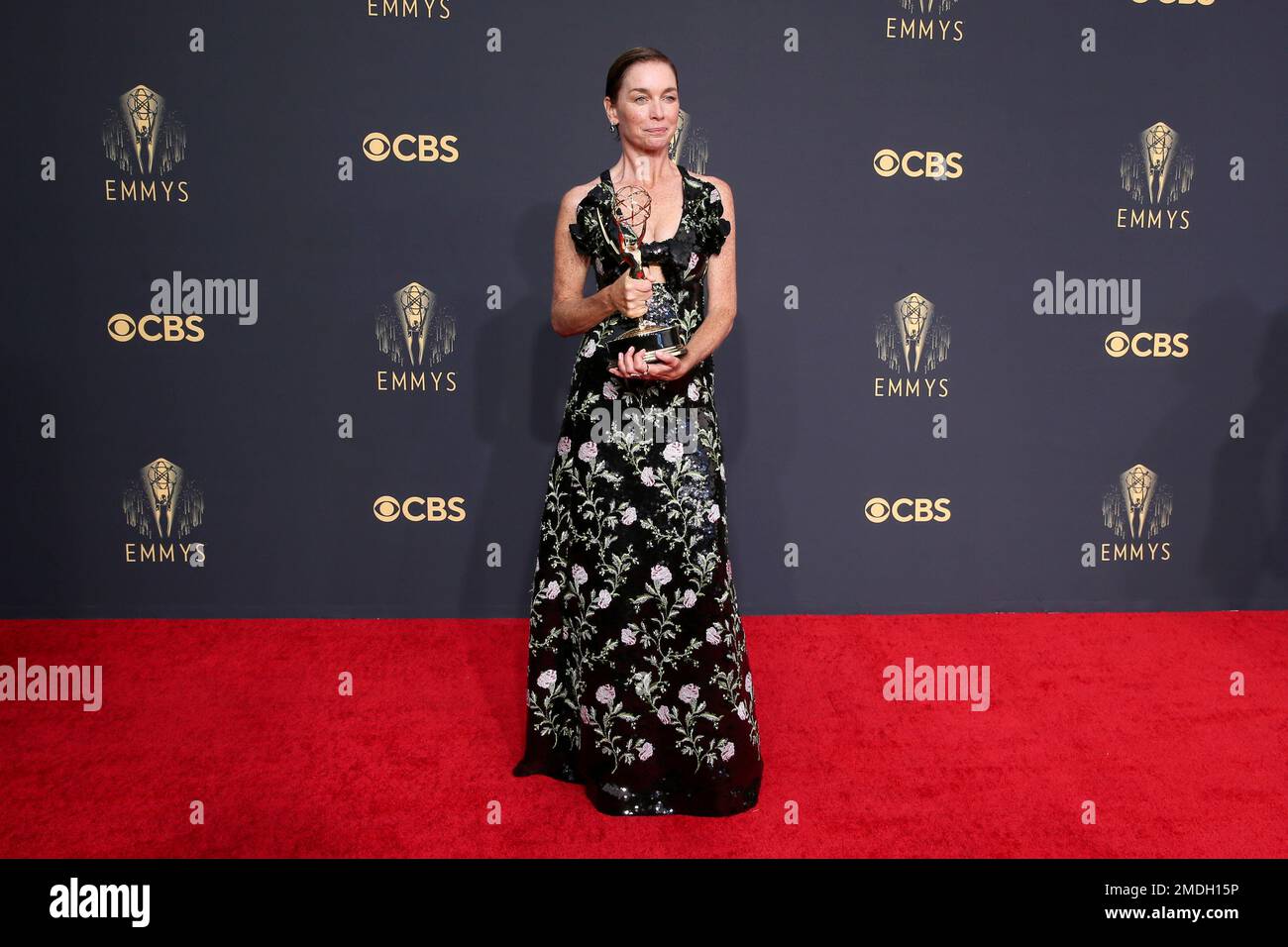 Julianne Nicholson poses for a photo with the award for outstanding