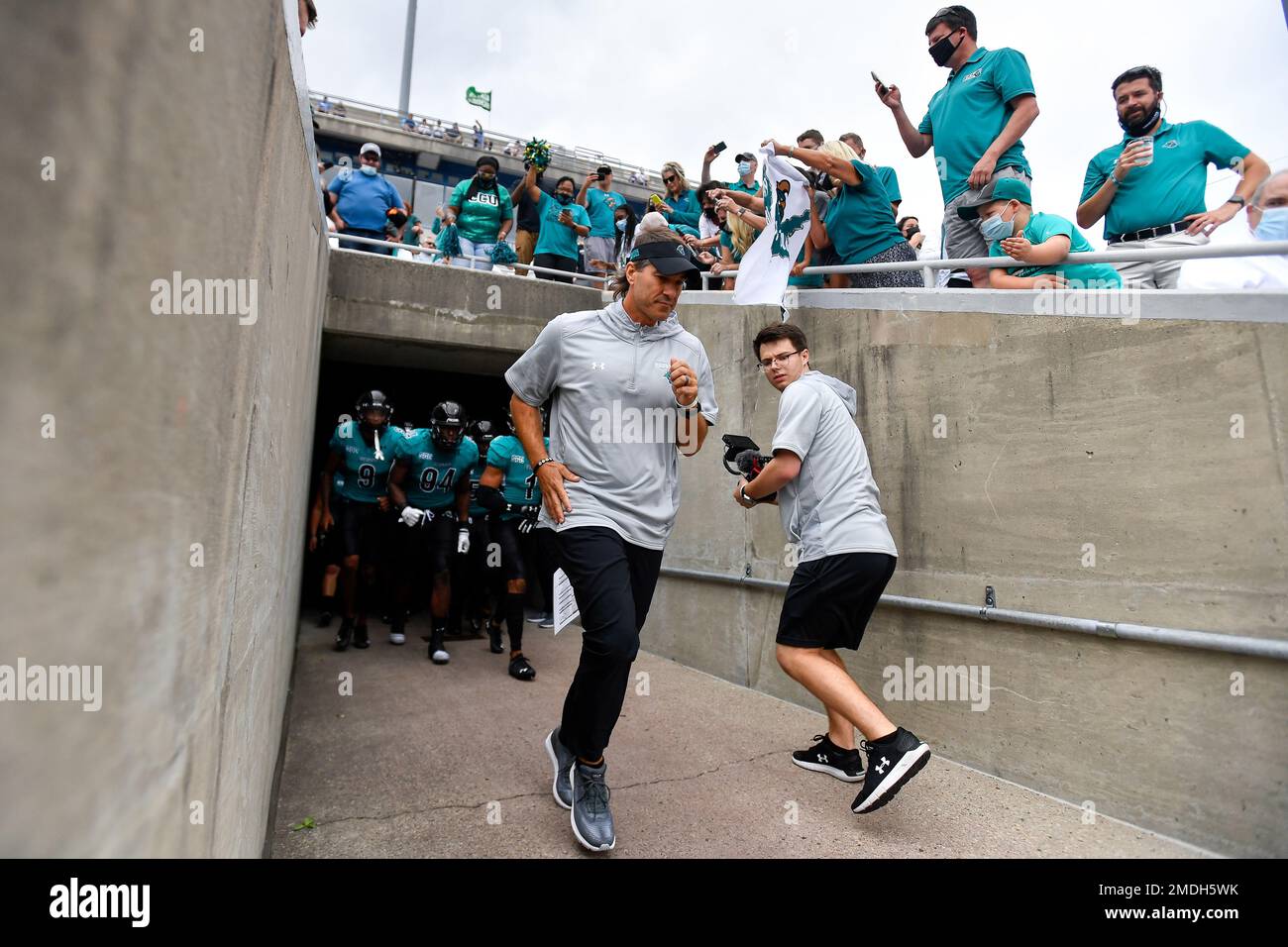Coastal Carolina head coach Jamey Chadwell leads his team out of the