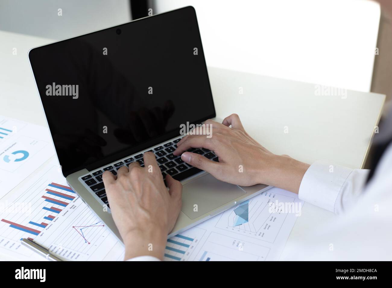 Financial businessmen use laptop to analyze marketing strategies and