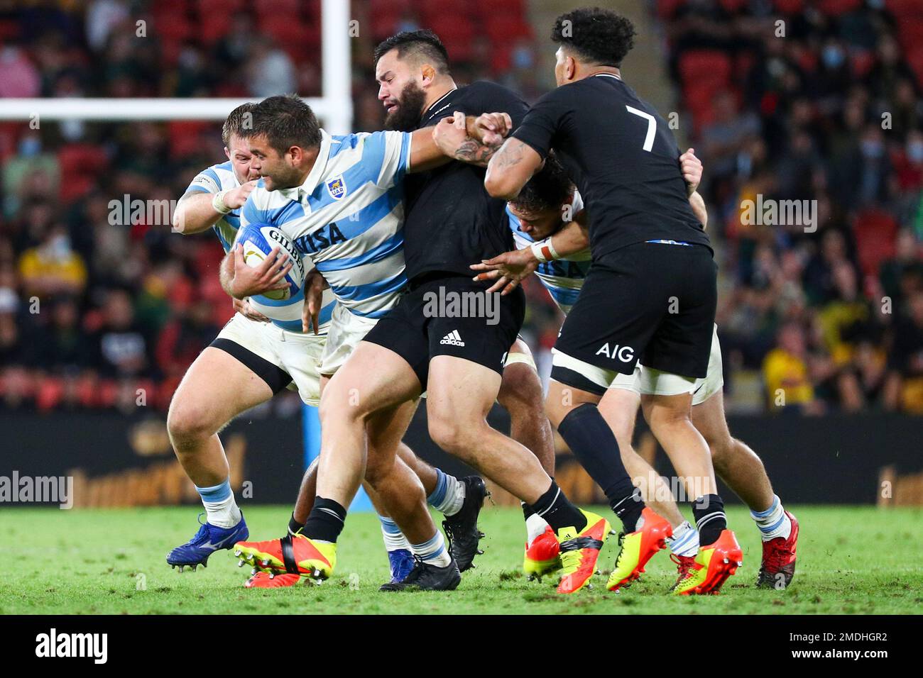 Argentina's Santiago Medrano, left, is tackled by defenders during the Rugby  Championship test match between the All Blacks and the Pumas in Brisbane,  Australia, Saturday, Sept. 18, 2021. (AP Photo/Tertius Pickard Stock