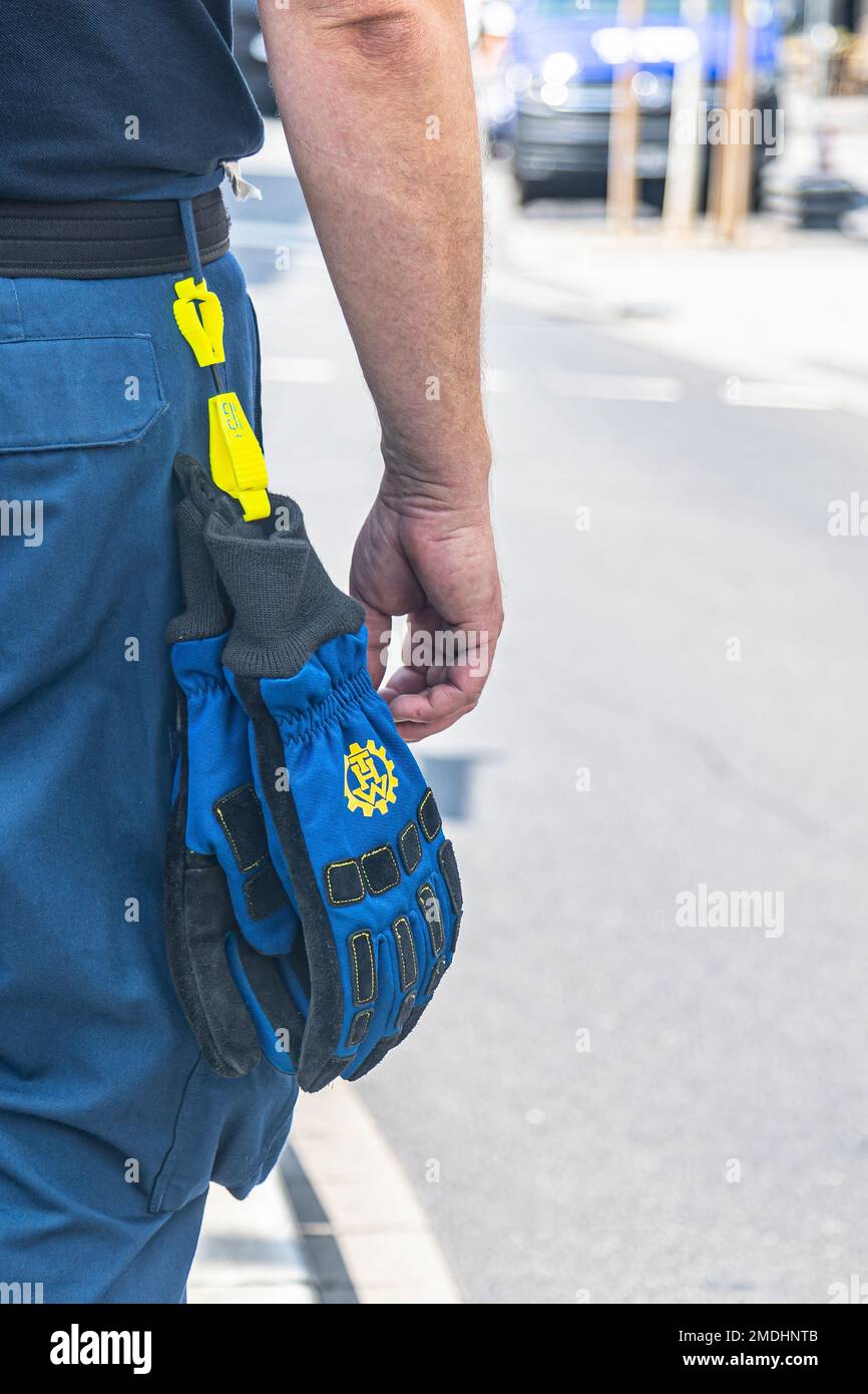 part of a volunteer of the "Technisches Hilfswerk" (Federal Agency for  Technical Relief) with the sign "THW" on his gloves Stock Photo - Alamy