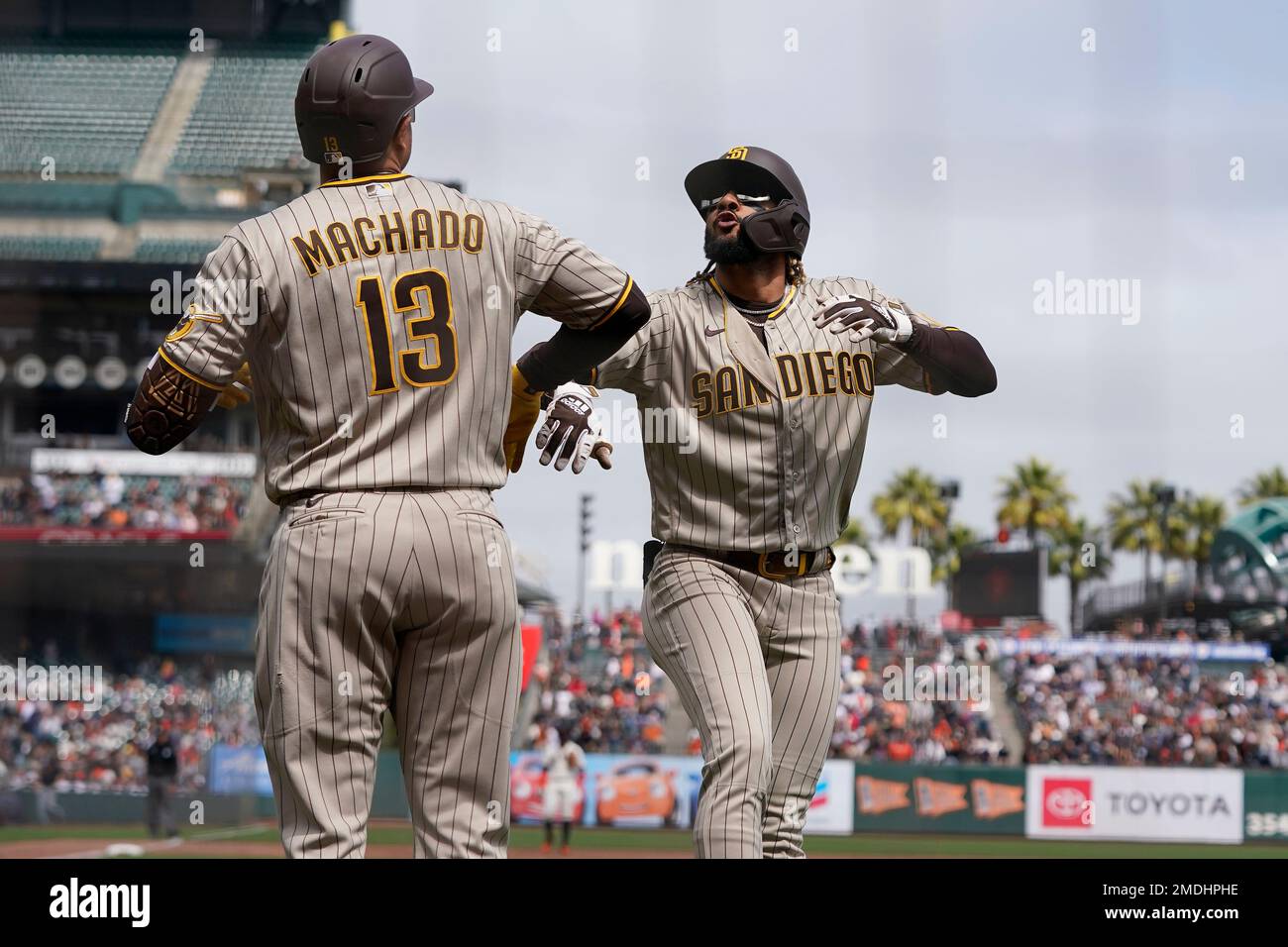 San Diego Padres' Fernando Tatis Jr., right, celebrates with Manny