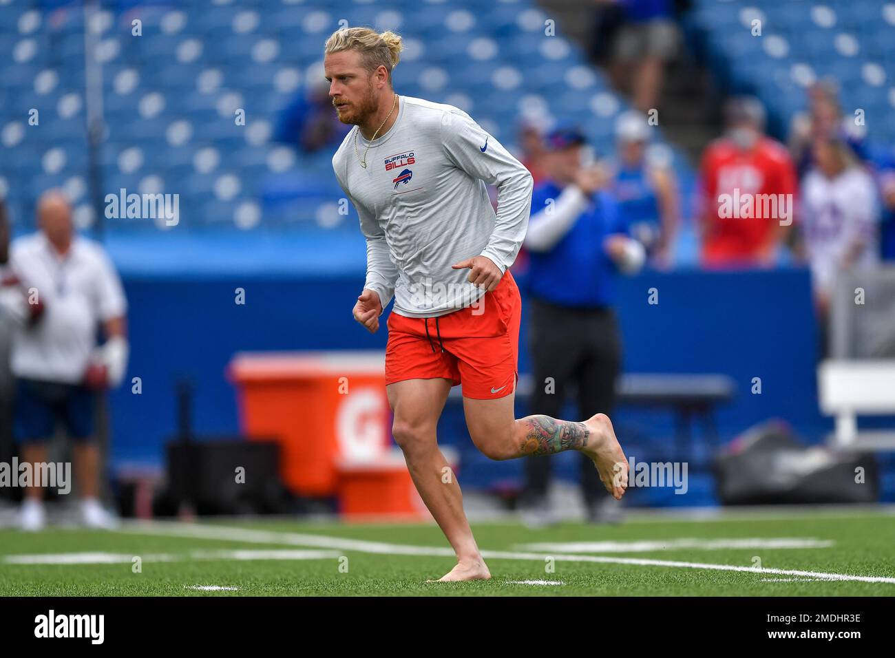 Buffalo Bills wide receiver Cole Beasley warms up barefooted before an