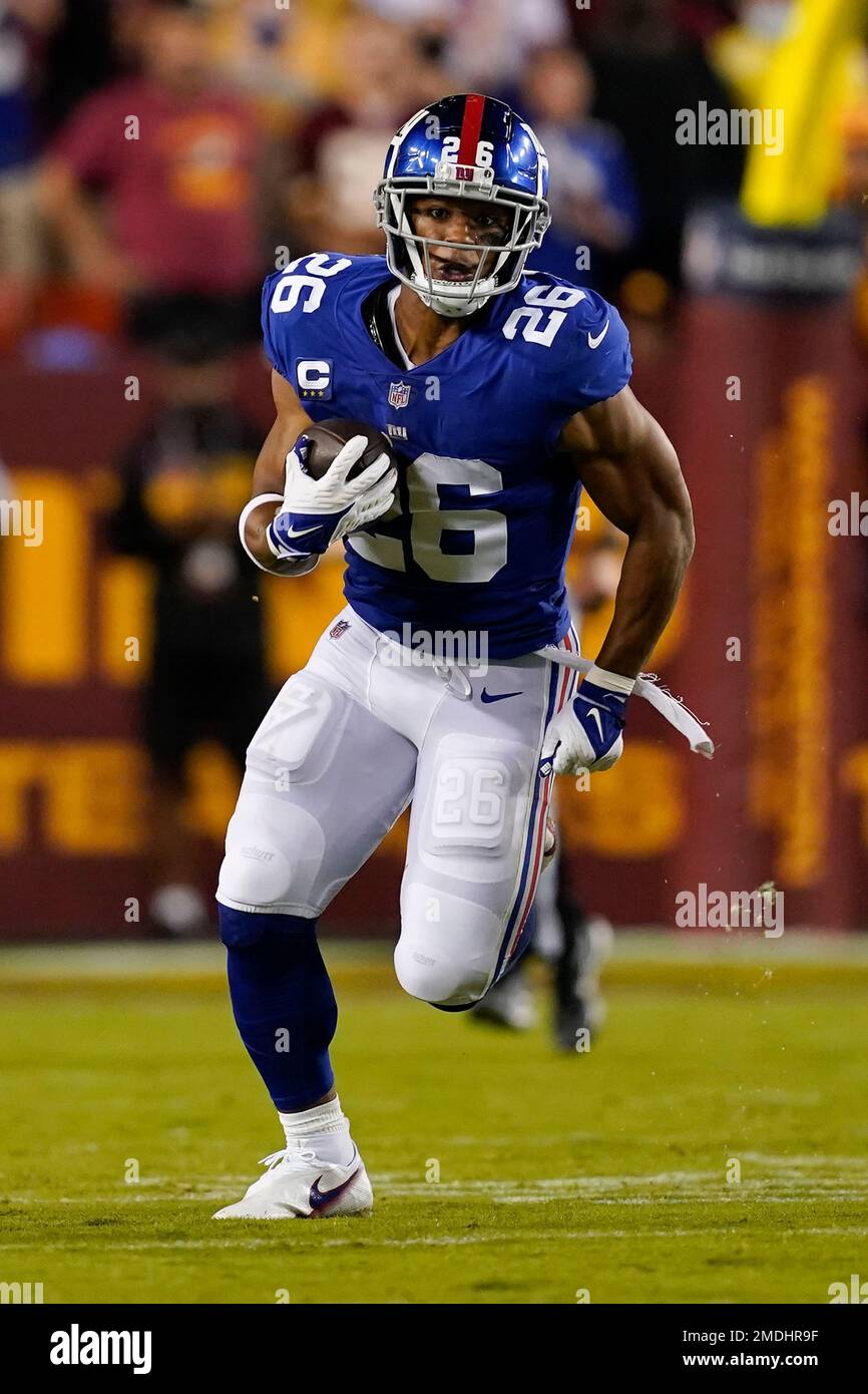 New York Giants running back Saquon Barkley (26) running with the ball  during the first half of an NFL football game, Thursday, Sept. 16, 2021, in  Landover, Md. (AP Photo/Alex Brandon Stock