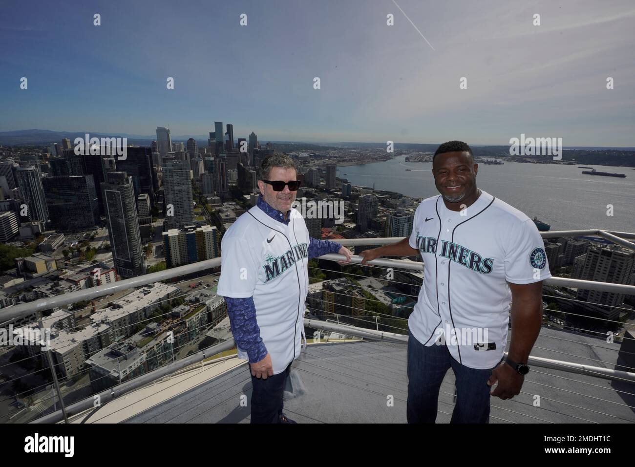 Seattle Mariners greats Edgar Martinez, left, and Ken Griffey Jr. pose for  photos after they raised a flag for the 2023 All-Star Game on the roof of  the Space Needle, Thursday, Sept.