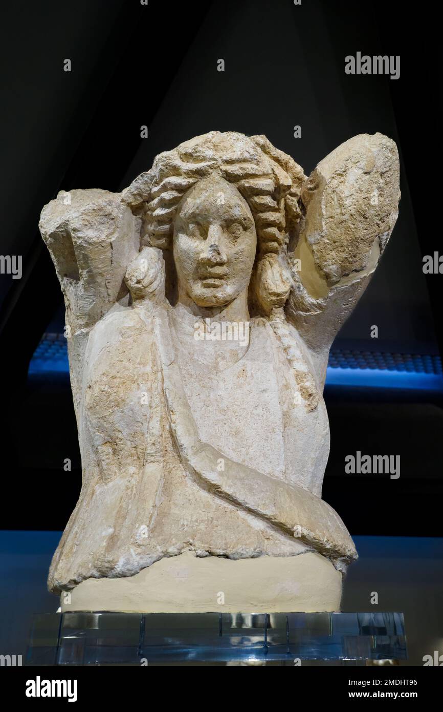 Fragmentary statue of a maenad in limestone. III century BC. It is a fine example of a caryatid, probably part of the monumental arrangement of the theater by Ierone II - Museo Archeologico Regionale Paolo Orsi - Syracuse, Sicily, Italy Stock Photo