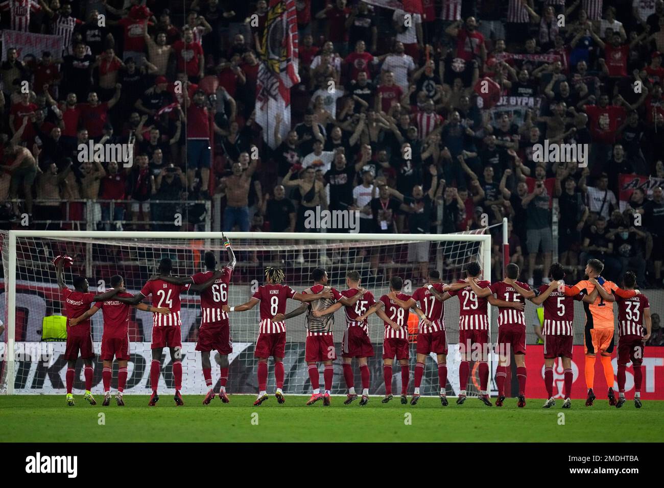 Olympiacos' players celebrate with their fans after the Europa League Group  D soccer match between Olympiacos and Antwerp in Piraeus port, near Athens,  Greece, Thursday, Sept. 16, 2021. Olympiacos won 2-1. (AP