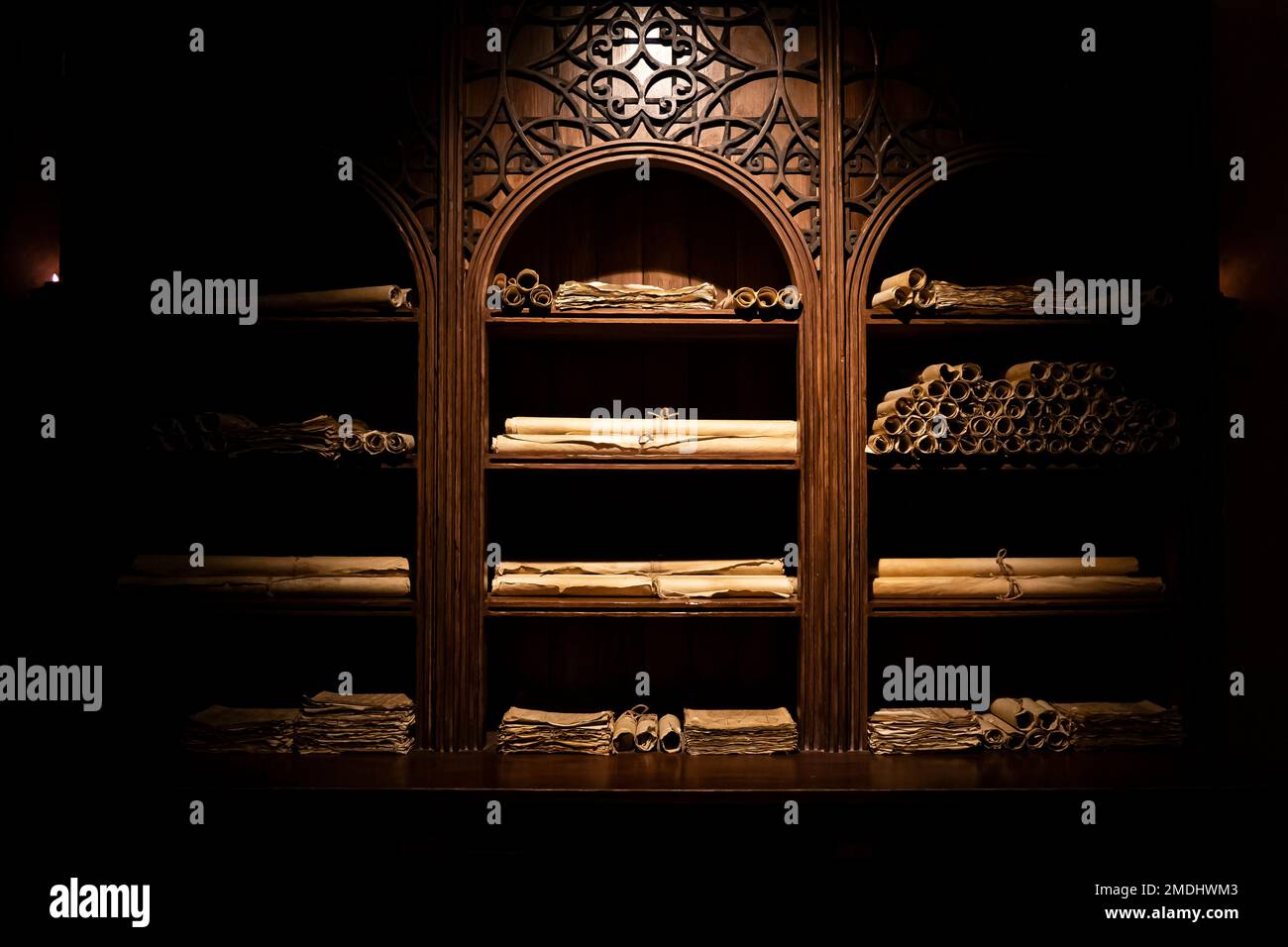old scrolls on shelves at night in the dark Stock Photo Alamy