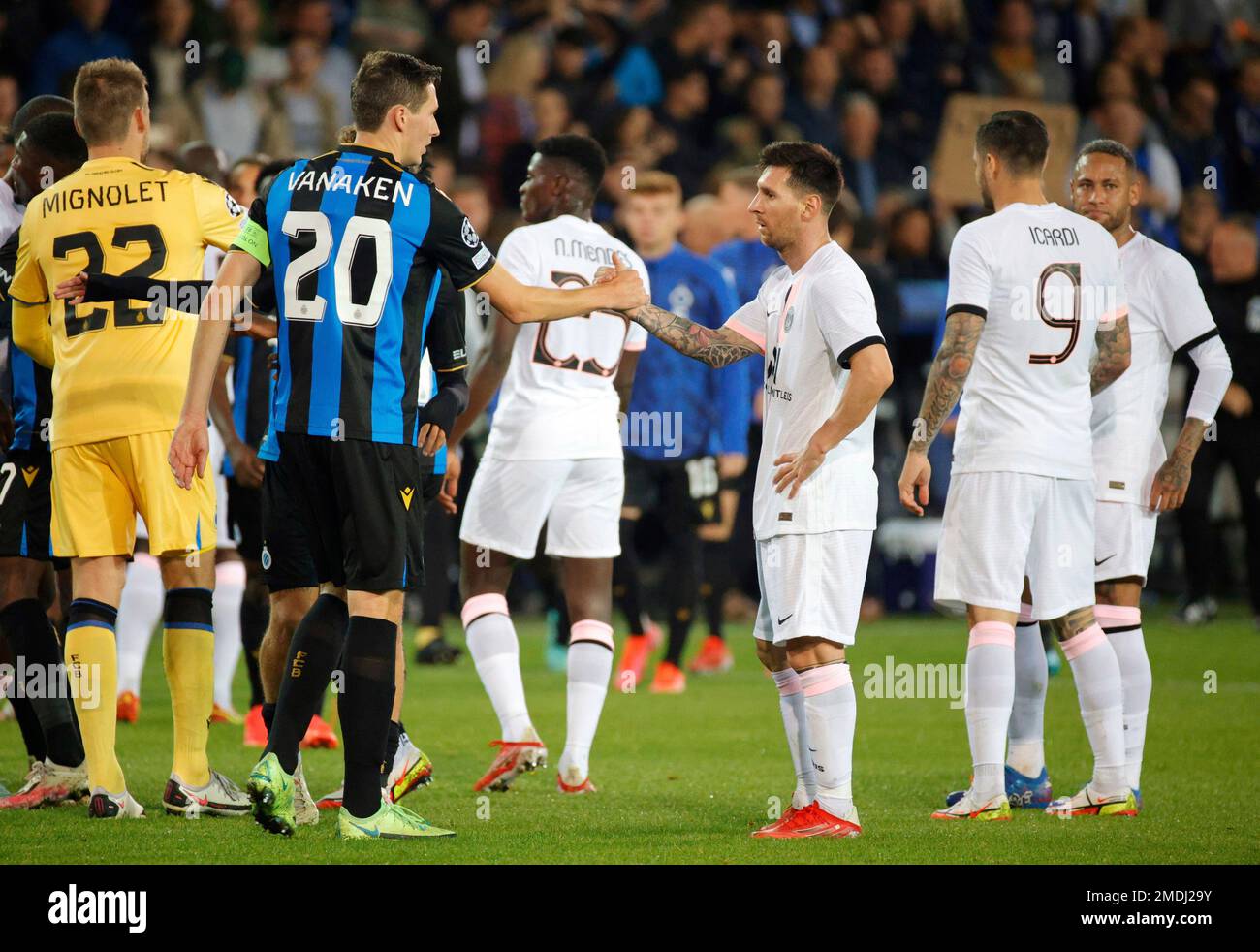 PSG's Lionel Messi, center right, shakes hands with Brugge's Hans Vanaken,  center left, at the end of the Champions League Group A soccer match  between Club Brugge and PSG at the Jan