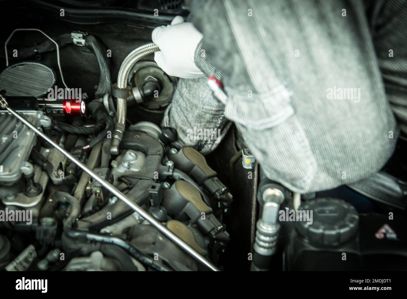 Shooting the moment when an auto mechanic replaces parts Stock Photo
