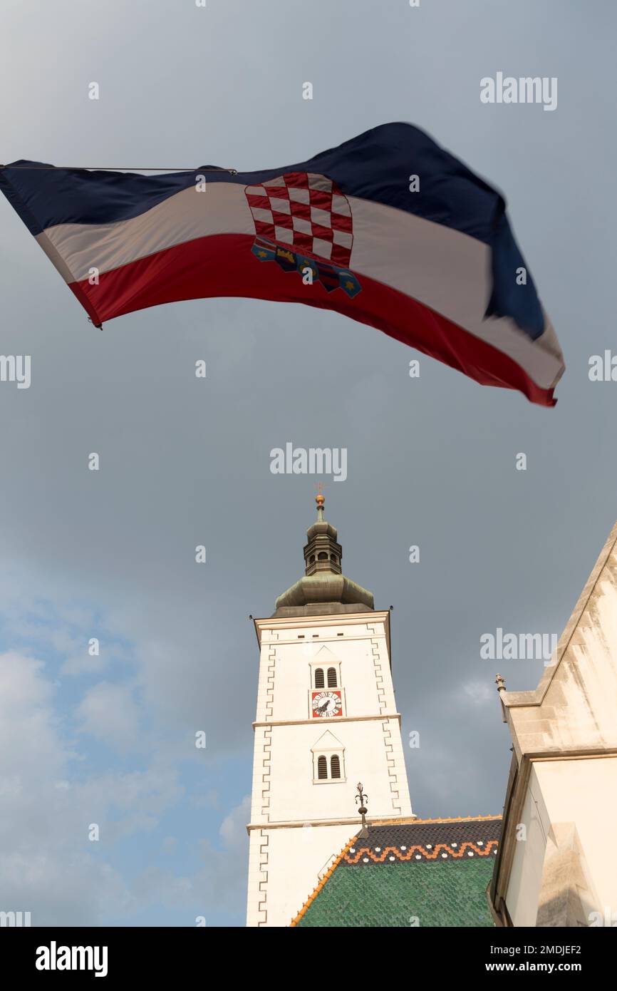 Croatia, Zagreb, St. Mark's Church (b.1880) and Croatian flag  in the old town. Stock Photo