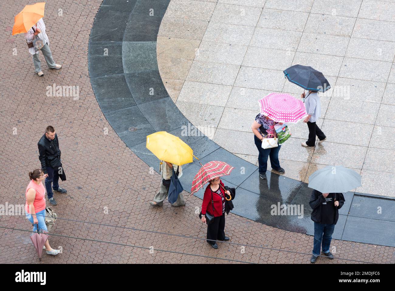 Croatia, Zagreb, people waiting for trams in the main square - Trg bana Jelacica. Stock Photo