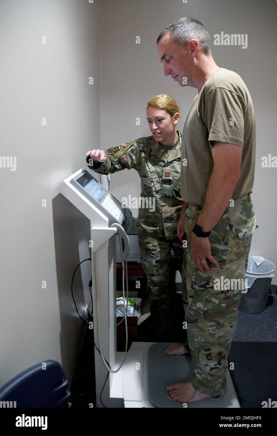 U.S. Air Force Capt. Kathryn Welch 81st Diagnostic and Therapeutics Squadron nutritional medicine flight commander assists Col. Christopher Estridge 81st Medical Group commander with using the In Body...