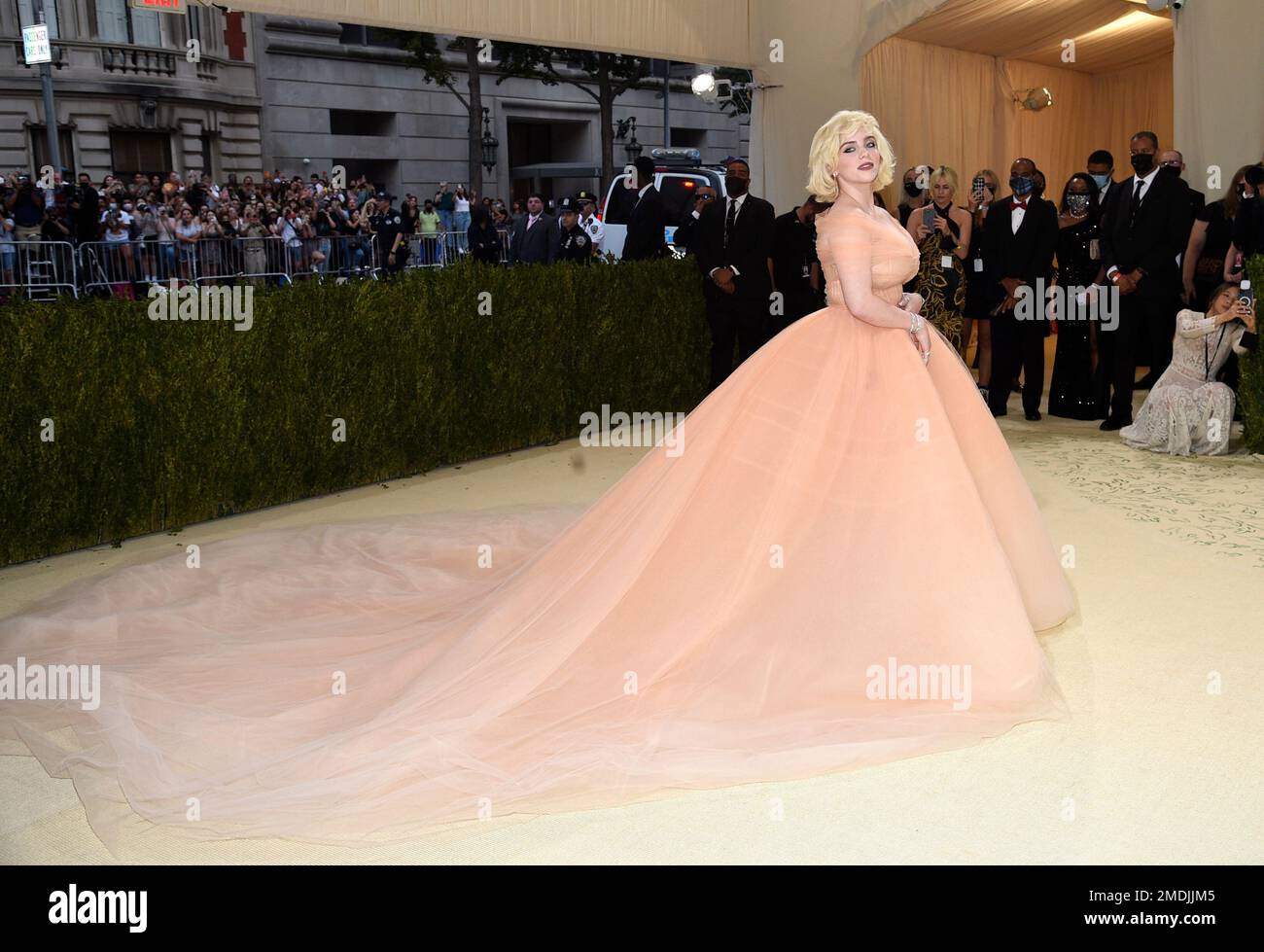billie eilish met gala pink dress Billie Eilish ticked all the boxes at the Met Gala in an off-the-shoulder  peach tulle ball gown by Oscar Del La Renta