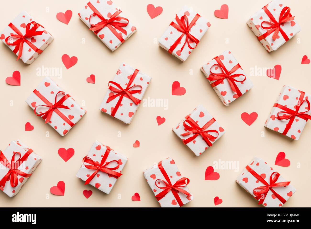 Valentine day composition Background: red gift box with bow and heart ...