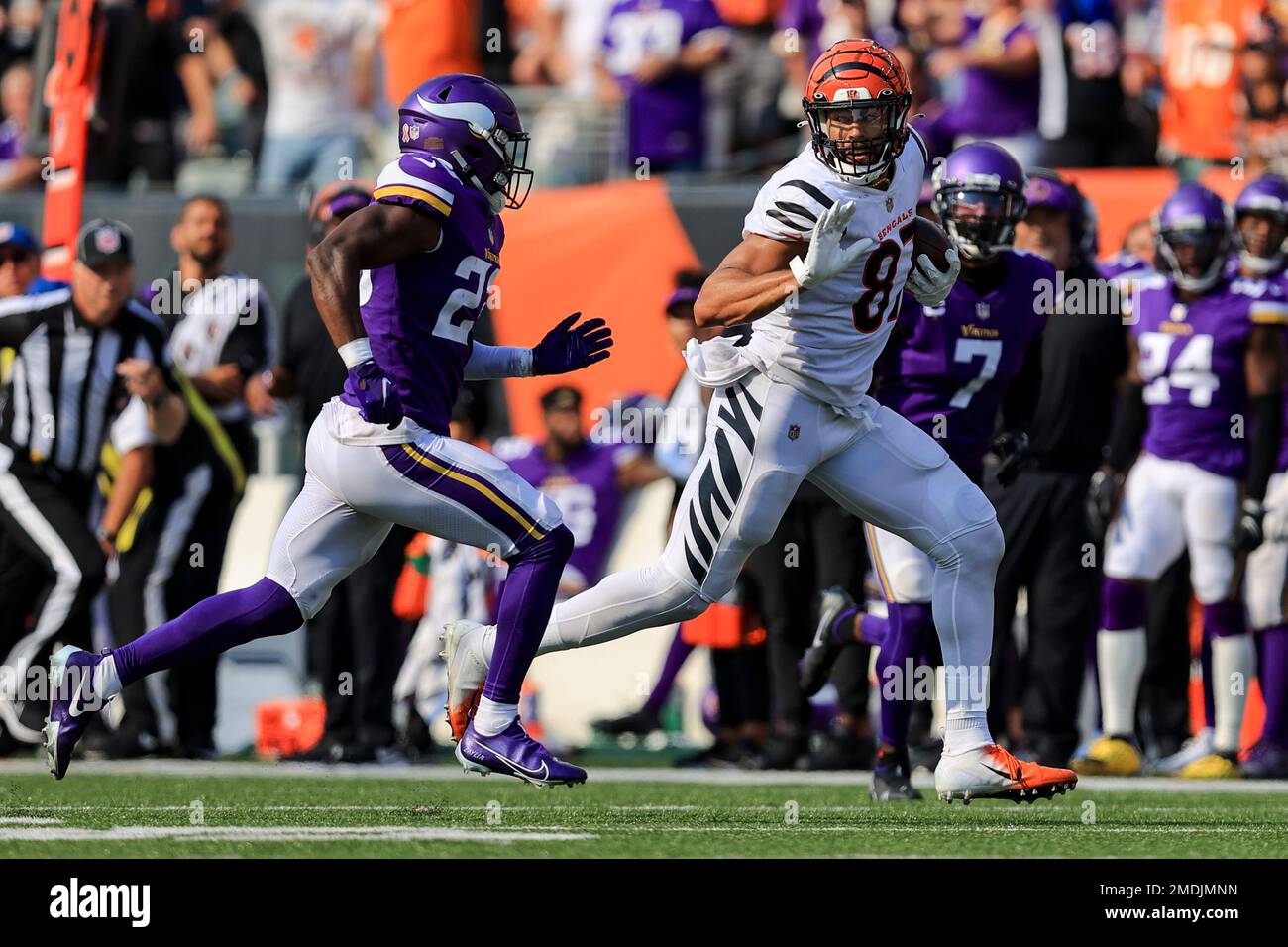 Minnesota Vikings free safety Xavier Woods (23) defends against Cincinnati  Bengals tight end C.J. Uzomah (87) as he carries the ball during an NFL  football game, Sunday, Sept. 12, 2021, in Cincinnati.