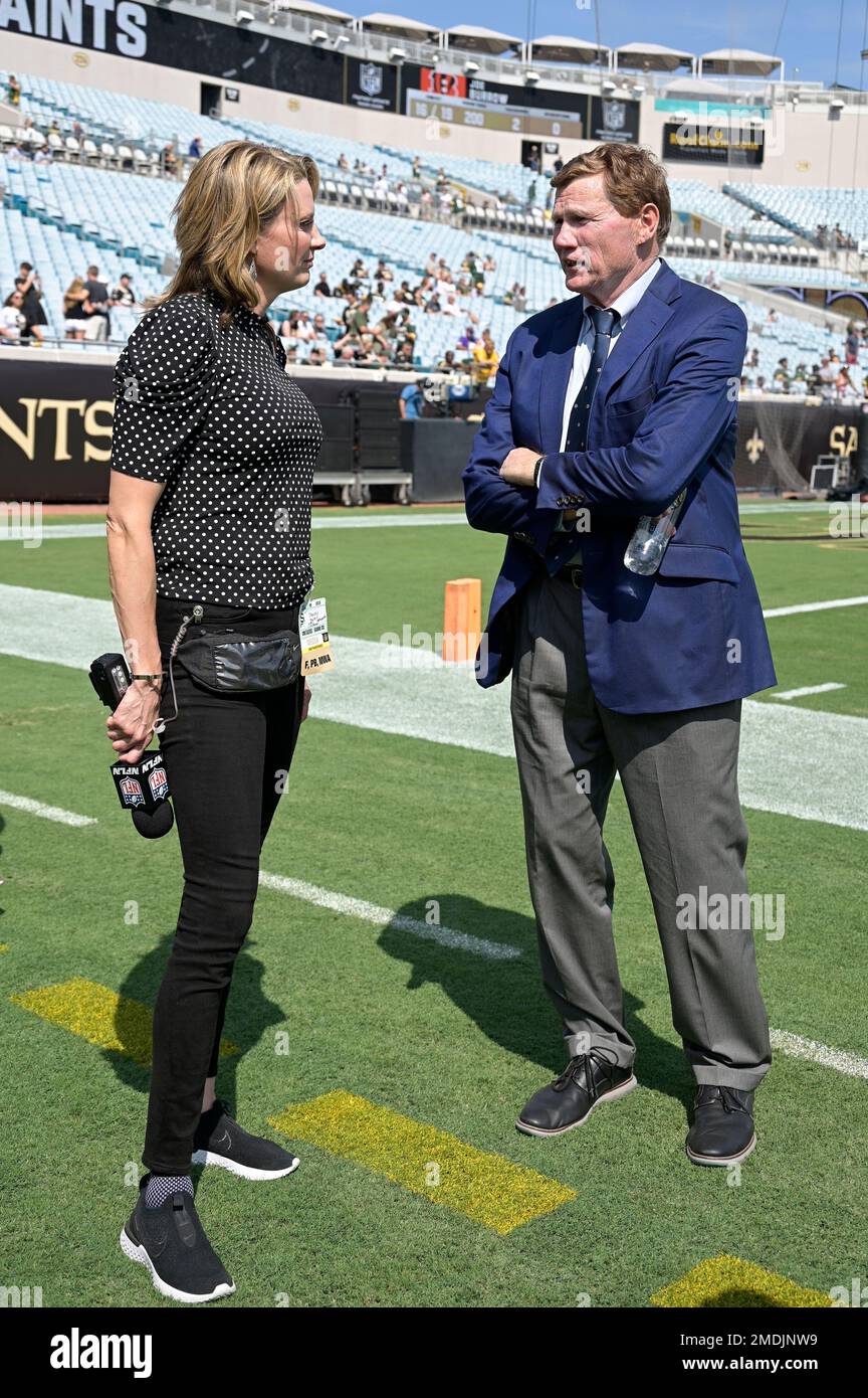 NFL Network reporter Stacey Dales, left, talks with Green Bay Packers  President and CEO Mark Murphy on the sideline before an NFL football game  against the New Orleans Saints, Sunday, Sept. 12,