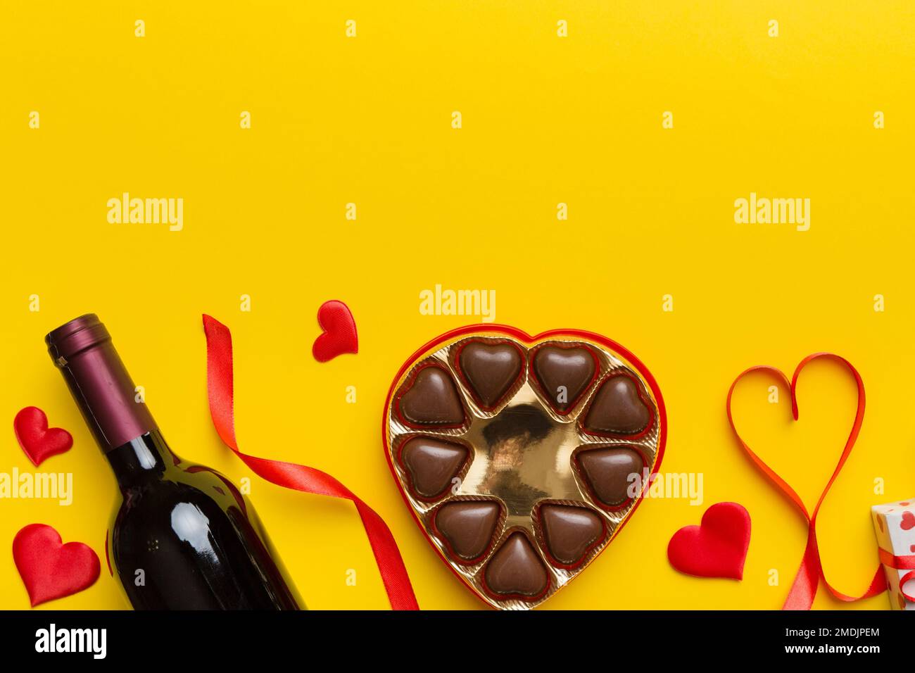Bottle of red wine on colored background for Valentine Day with ...