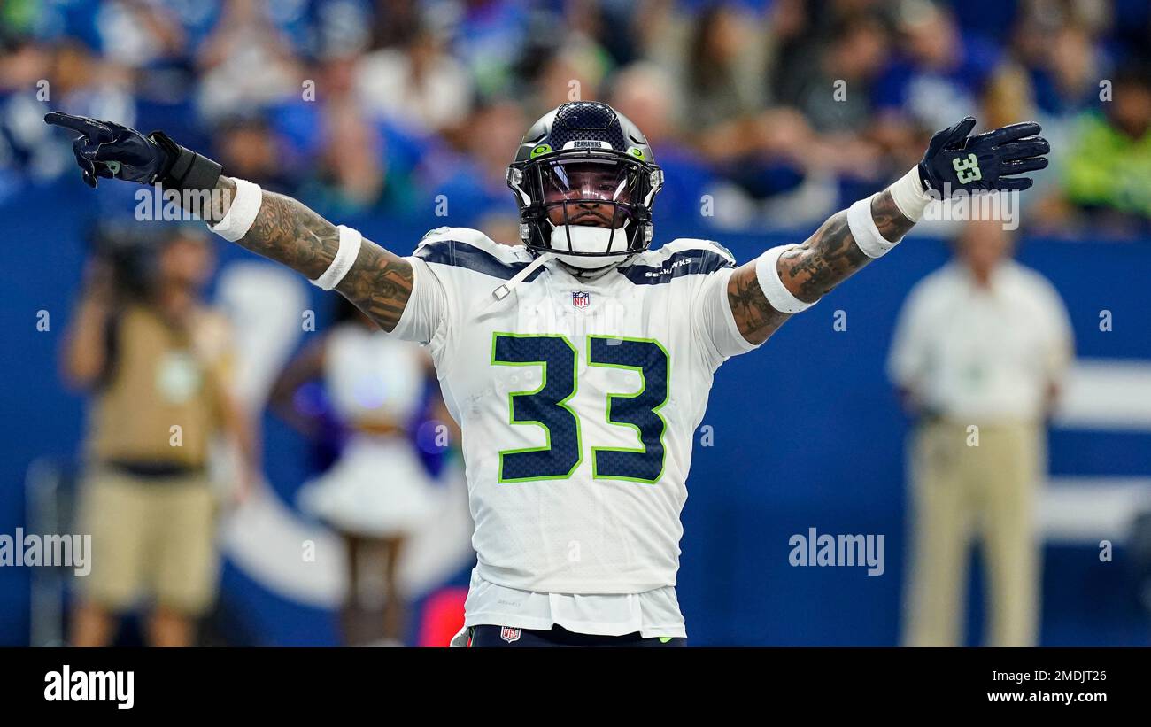 November 14, 2021: Seattle Seahawks safety Jamal Adams (33) and outside  linebacker Jordyn Brooks (56) tackle Green Bay Packers running back A.J.  Dillon (28) during the NFL football game between the Seattle