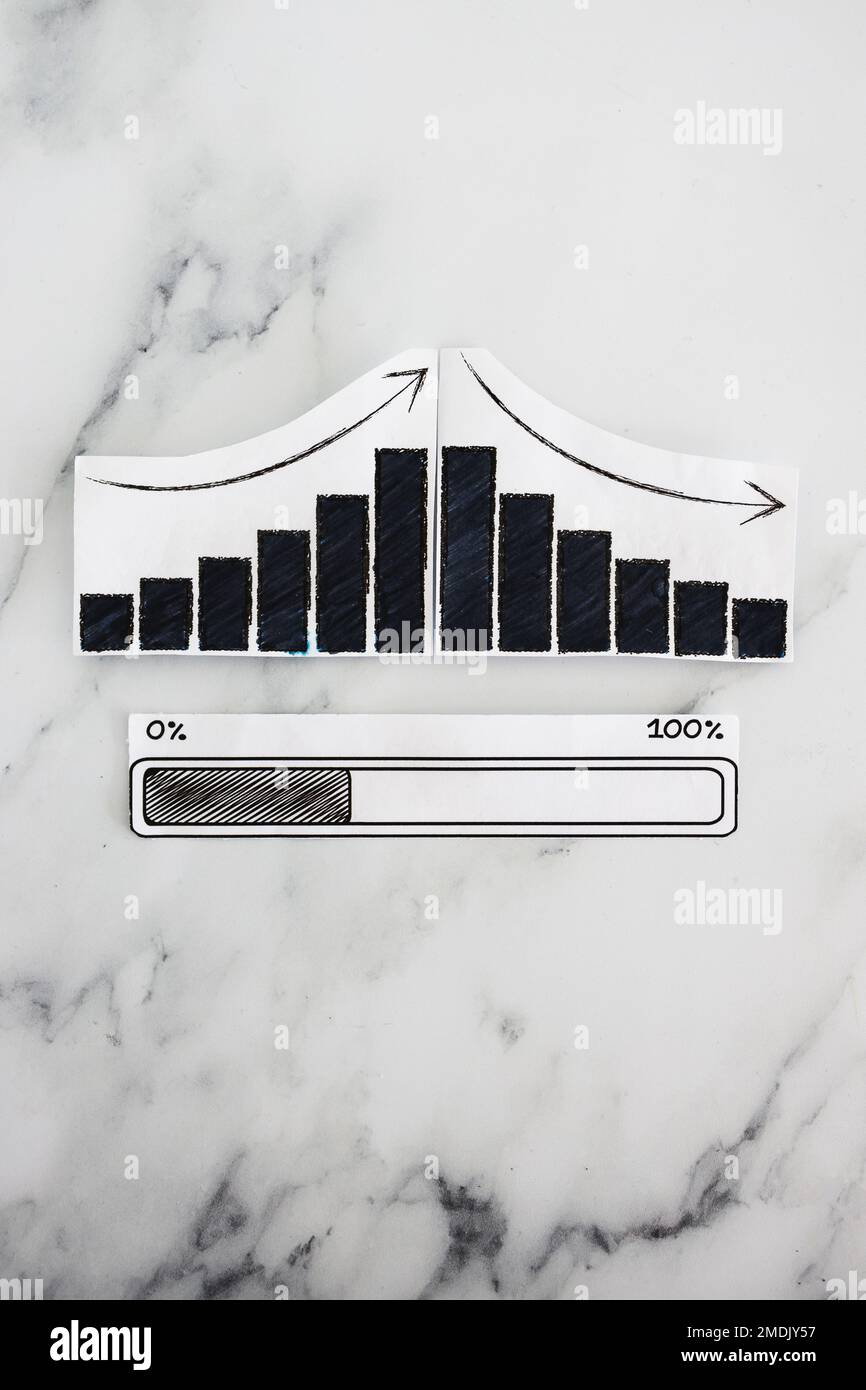 economy or statistics going up and down with progress bar loading underneath Stock Photo