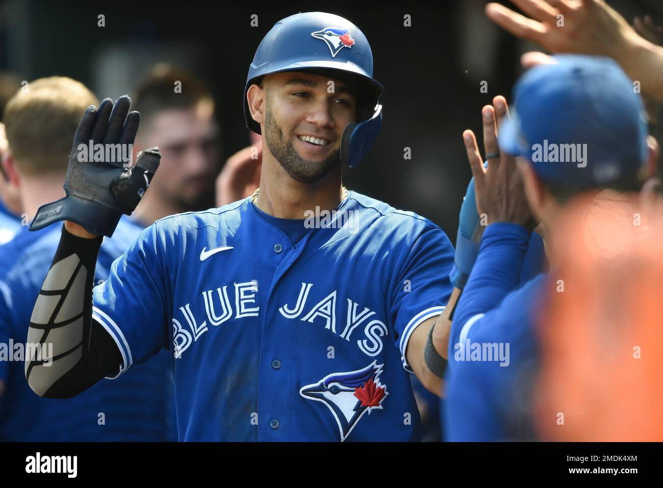 Toronto Blue Jays' Lourdes Gurriel Jr. is congratulated after scoring on a  double by Breyvic Valera in the third inning of a baseball game against the  Baltimore Orioles Sunday, Sept. 12, 2021