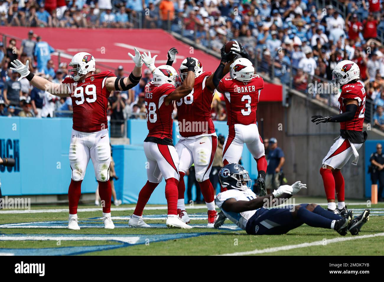 Arizona Cardinals defensive end J.J. Watt (99) celebrates after teammate  Corey Peters, third from left, recovered a Tennessee Titans fumble in the  first half of an NFL football game Sunday, Sept. 12,