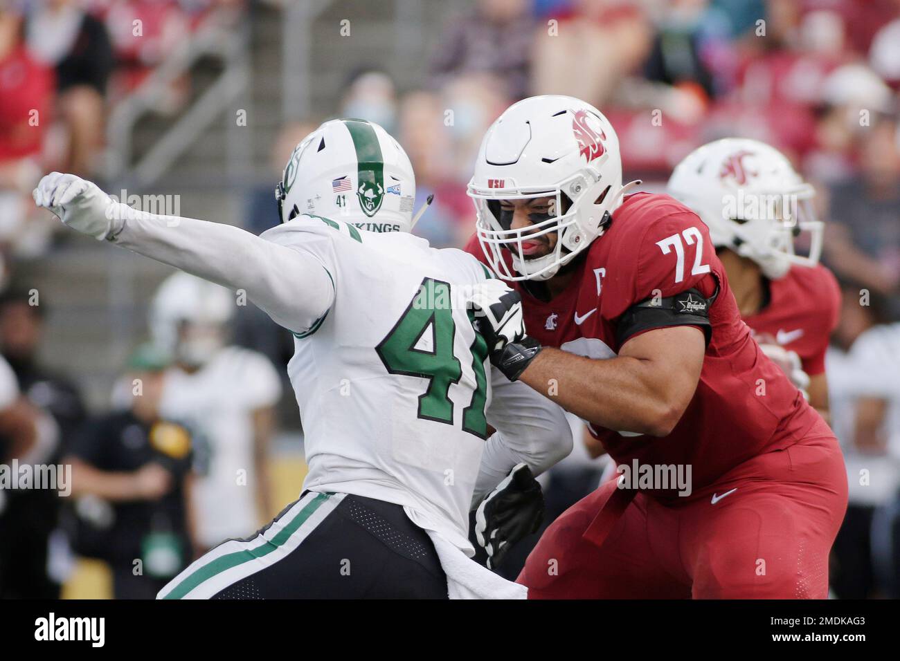 Washington State offensive lineman Abraham Lucas (72) blocks Portland State  linebacker Justice Pagan (41) during the