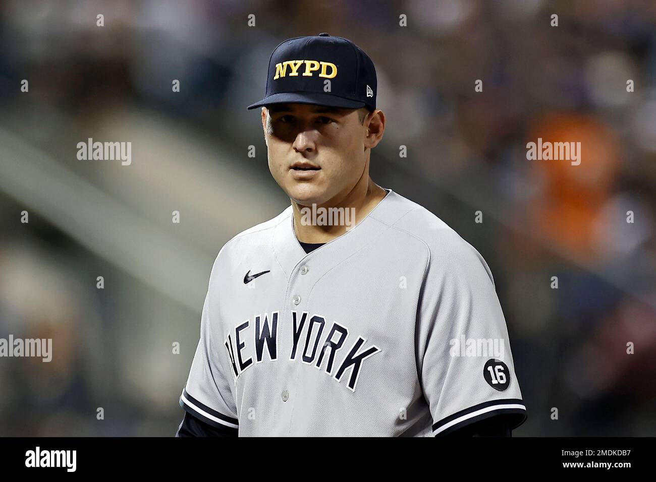 New York Yankees first baseman Anthony Rizzo looks on in an NYPD hat  against the New York Mets during the seventh inning of a baseball game on  Saturday, Sept. 11, 2021, in