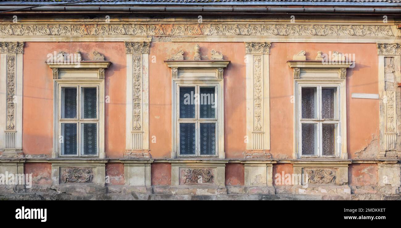 vintage windows on the old facade. abandoned architecture exterior Stock Photo