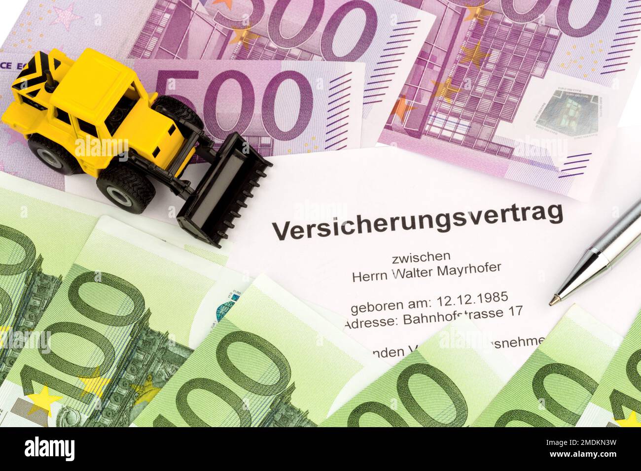 insurance contract for an excavator, composing Stock Photo Alamy