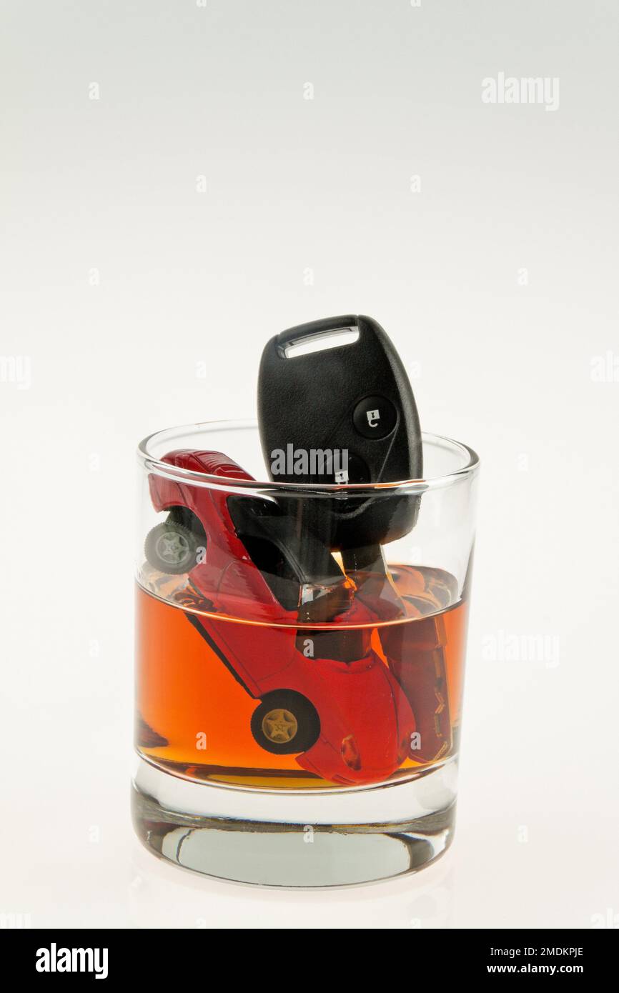car in a glass of alkohol, drunken car driver Stock Photo Alamy