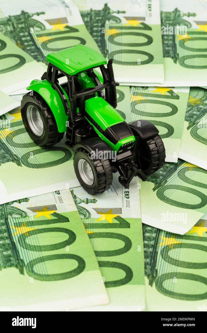 tractor on 100 Euro bills, composing Stock Photo