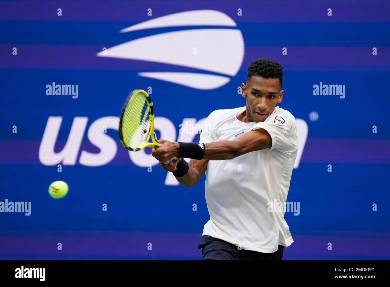 Felix Auger-Aliassime, of Canada, returns a shot to Daniil Medvedev, of Russia, during the semifinals of the US Open tennis championships, Friday, Sept
