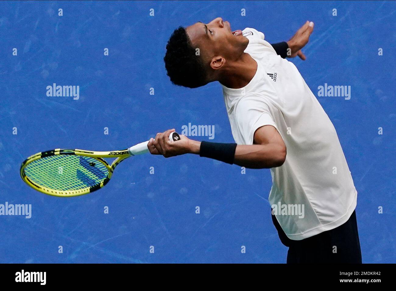 Felix Auger-Aliassime, of Canada, serves to Daniil Medvedev, of Russia, during the semifinals of the US Open tennis championships, Friday, Sept