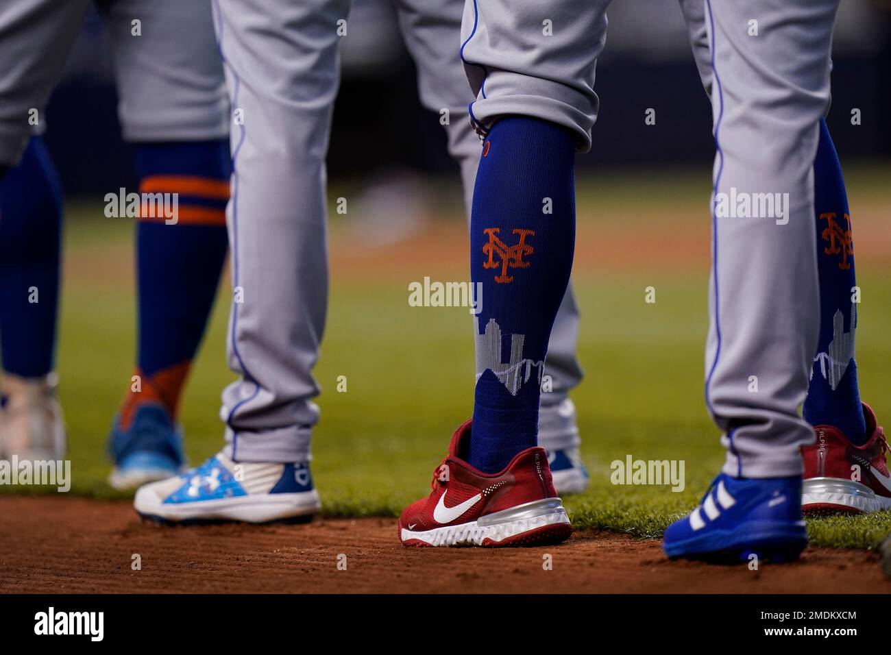 New York Mets players stand during the singing of the National Anthem