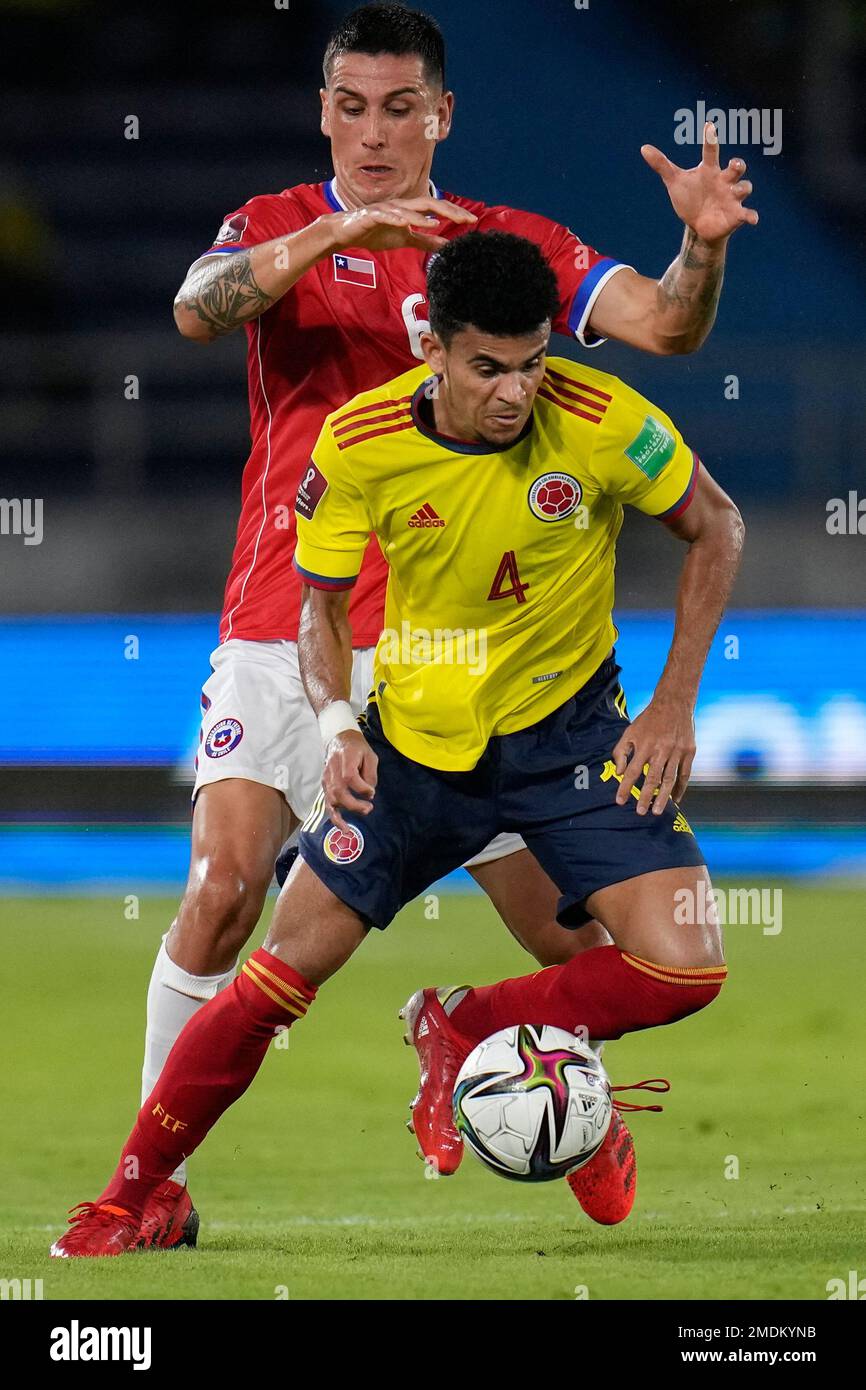 Enzo Roco Chile's Enzo Roco, back, challenges Colombia's Carlos Cuesta during a ...