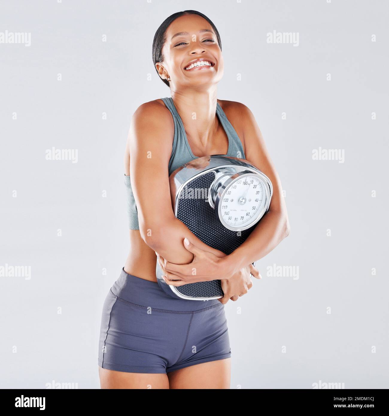 Diet, weightloss and scale with a black woman athlete in studio on a gray  background for body positivity or health. Fitness, weightscale and losing  Stock Photo - Alamy