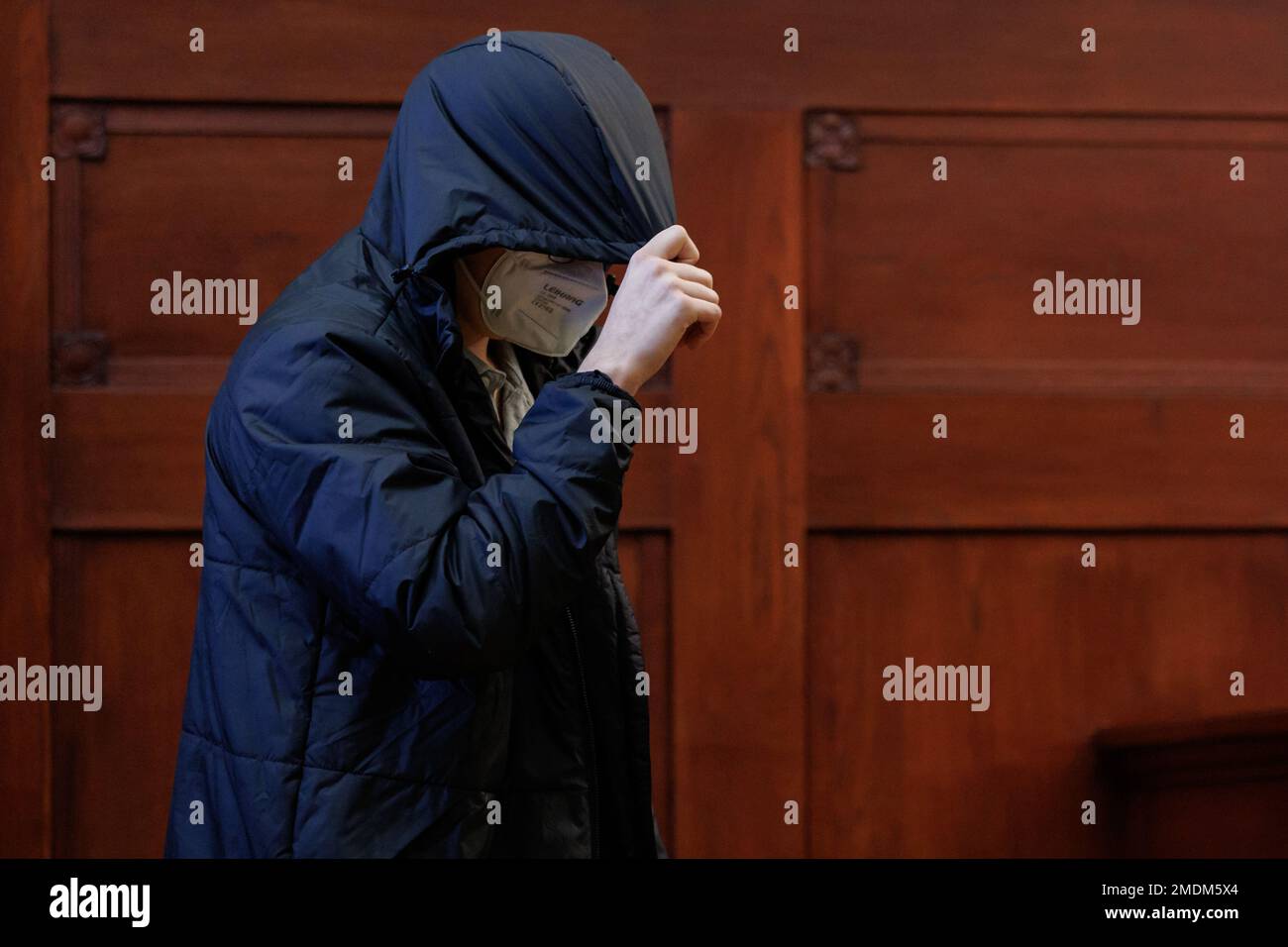 Bayreuth, Germany. 23rd Jan, 2023. The accused 19-year-old young man comes into the courtroom in the regional court. At the beginning of January 2022, a doctor couple had been murdered in Upper Franconia. The victims had been stabbed to death in their bedroom at night. The defendants are the 18-year-old boyfriend of the couple's daughter at the time of the crime and the then 16-year-old daughter herself. The two defendants have now been found guilty. (to dpa Daughter and boyfriend convicted of double murder) Credit: Daniel Karmann/dpa/Alamy Live News Stock Photo