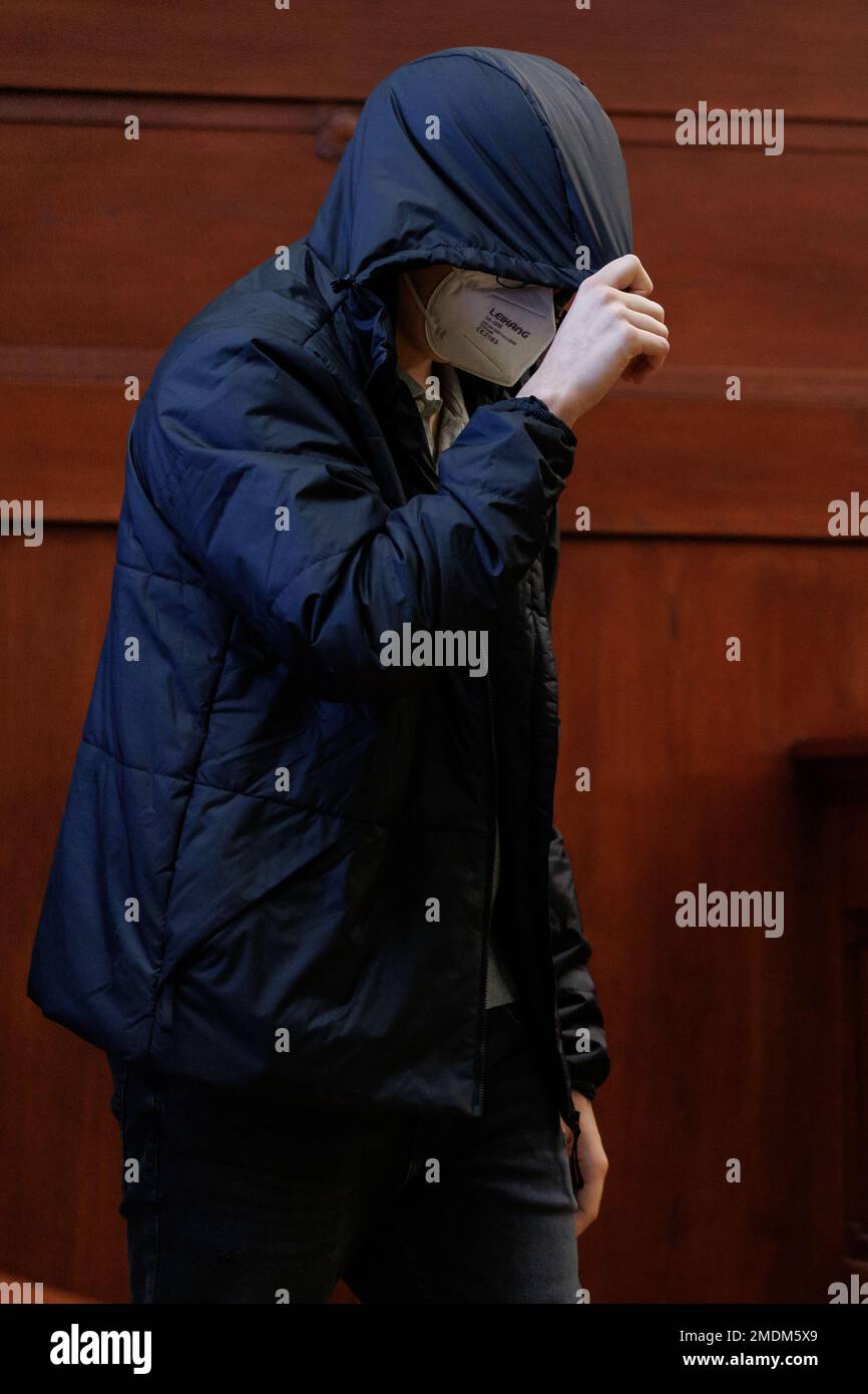 Bayreuth, Germany. 23rd Jan, 2023. The accused 19-year-old young man comes into the courtroom in the regional court. At the beginning of January 2022, a doctor couple had been murdered in Upper Franconia. The victims had been stabbed to death in their bedroom at night. The defendants are the 18-year-old boyfriend of the couple's daughter at the time of the crime and the then 16-year-old daughter herself. The two defendants have now been found guilty. (to dpa Daughter and boyfriend convicted of double murder) Credit: Daniel Karmann/dpa/Alamy Live News Stock Photo