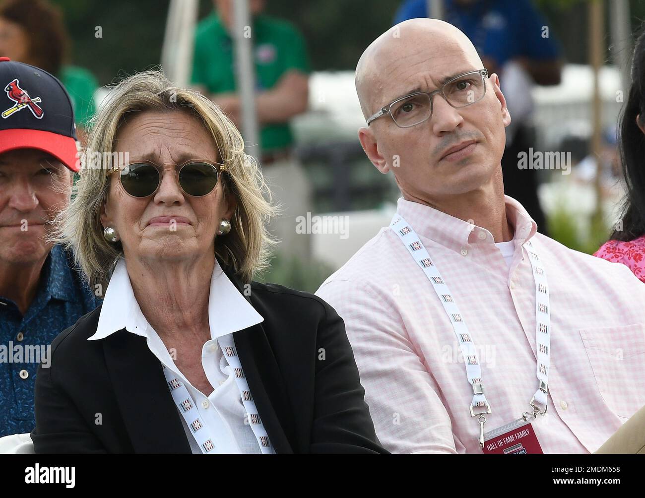 As Ted Simmons speaks, his wife, Maryanne Simmons left, and brother Matthew  Simmons watch during inductions at the Baseball Hall of Fame on Wednesday,  Sept. 8, 2021, in Cooperstown, N.Y. (AP Photo/Hans