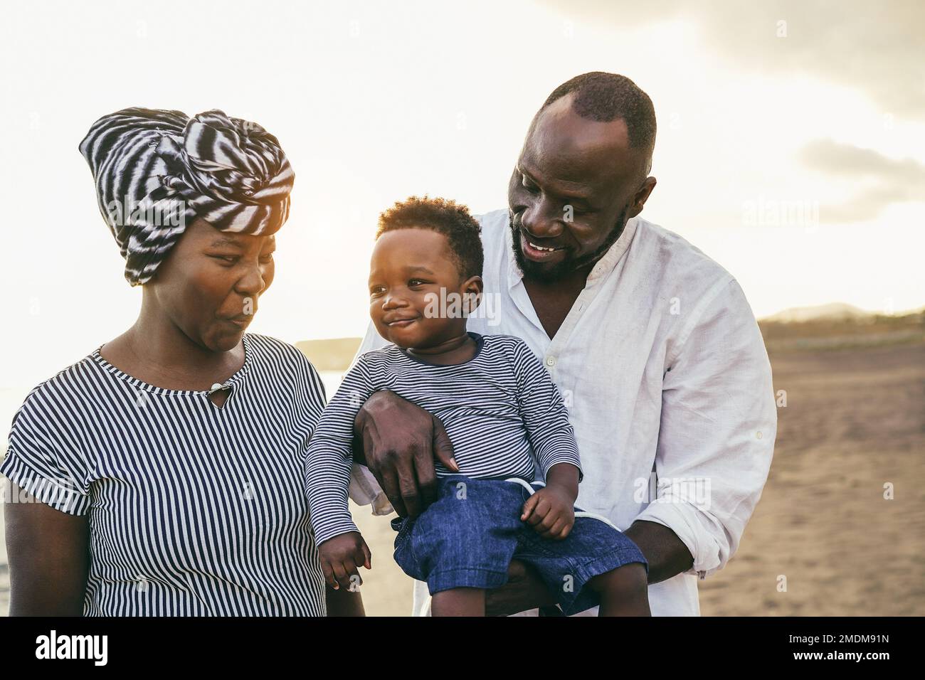 African family having fun outdoor - Main focus on father face Stock Photo