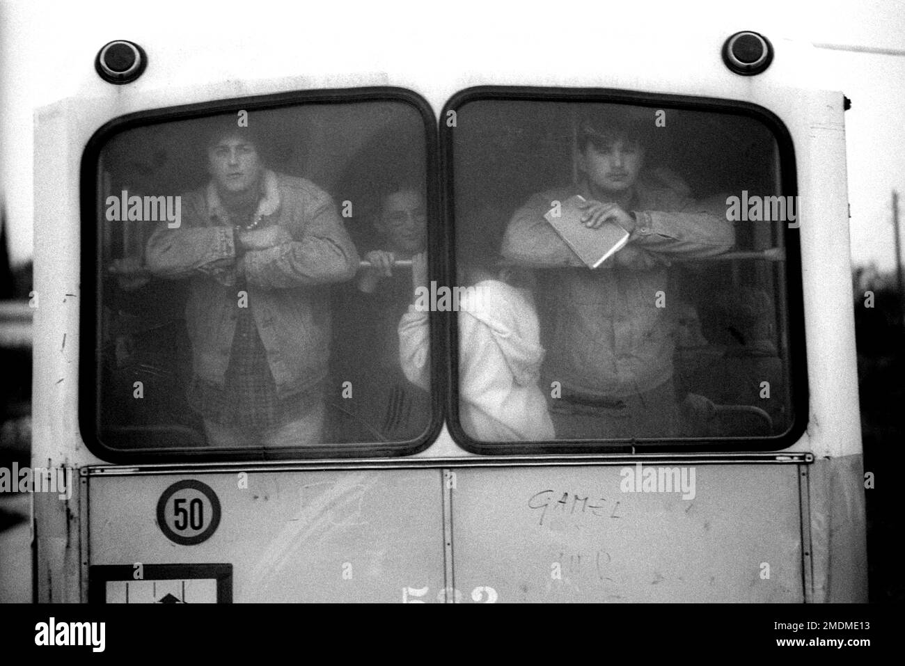 People traveling on a bus in Sarajevo during the civil war and siege in 1994 Stock Photo