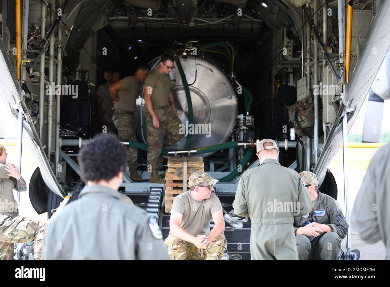 Crew members prepapre a C-130H Hercules aircraft and installed prototype modular aerial spray system for its first test flight at Youngstown Air Reserve Station, Ohio, July 25, 2022. The prototype system looks to replace the unit's decades old modular aerial spray system. The 910th Airlift Wing operates the Department of Defense's only large-area, fixed-wing aerial spray capability to eliminate pest and disease-carrying insects, remove invasive and wildfire-causing vegetation and disperse oil spills in large bodies of water. (U.S. Air Force photo Eric M. White) Stock Photo