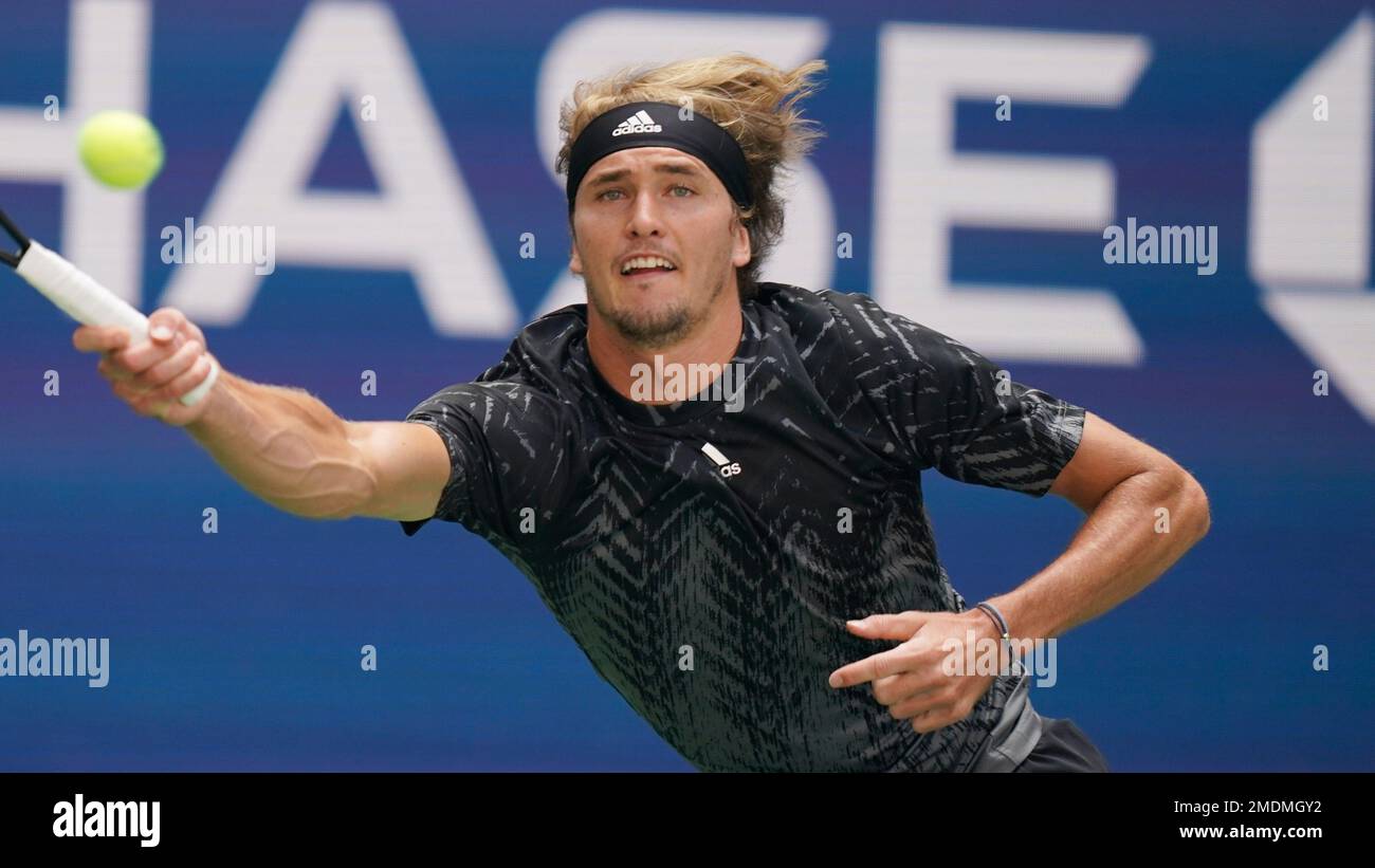 Alexander Zverev, of Germany, returns a shot against Jannik Sinner, of Italy, during the fourth round of the US Open tennis championships, Monday, Sept